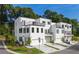 The exterior of a modern townhome with a balcony, garage, and manicured lawn at 2202 Carlton Ct # 7, Atlanta, GA 30318
