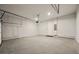 Spacious two-car garage featuring a concrete floor, automatic door, and access door, all within a clean, well-lit interior at 2202 Carlton Ct # 7, Atlanta, GA 30318