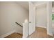 Hallway featuring hardwood floors, access to multiple rooms and a staircase at 2202 Carlton Ct # 7, Atlanta, GA 30318