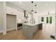 Bright kitchen with a large island, stainless steel appliances, and open layout to the living area at 2202 Carlton Ct # 7, Atlanta, GA 30318