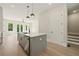 Open concept kitchen with a large island, stainless steel appliances, and lots of natural light at 2202 Carlton Ct # 7, Atlanta, GA 30318
