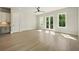 Bright living room with natural light, wood floors, and access to an outdoor balcony at 2202 Carlton Ct # 7, Atlanta, GA 30318