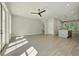 Open-concept living room with hardwood floors, recessed lighting, and a modern ceiling fan at 2202 Carlton Ct # 7, Atlanta, GA 30318