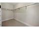Walk-in closet featuring carpet floors and hanging racks at 2202 Carlton Ct # 7, Atlanta, GA 30318