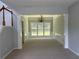 Elegant dining room with wainscoting, large windows, and a chandelier at 3118 Stanstead Ct, Norcross, GA 30071