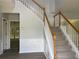 Inviting entryway with a staircase, gray walls, and modern wood-look flooring at 3118 Stanstead Ct, Norcross, GA 30071