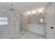 Modern bathroom features a glass shower and double vanity with gold hardware at 1095 Lyndhurst Way, Roswell, GA 30075