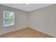 Neutral bedroom with hardwood floors and window at 1095 Lyndhurst Way, Roswell, GA 30075