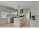 Bright and airy kitchen with white cabinetry, marble countertops, stainless appliances, and a kitchen island at 1095 Lyndhurst Way, Roswell, GA 30075