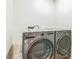 Laundry room showcasing modern front load washer and dryer set at 1095 Lyndhurst Way, Roswell, GA 30075