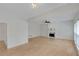 Open living room featuring hardwood floors and a decorative fireplace at 1095 Lyndhurst Way, Roswell, GA 30075