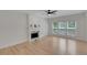 Cozy living room features hardwood floors, bright windows and a modern fireplace at 1095 Lyndhurst Way, Roswell, GA 30075