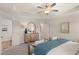 This bedroom features a tray ceiling, plush carpet, and a decorative dresser and mirror at 1328 Magnolia Bend Way # 289, Jonesboro, GA 30238