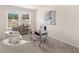 Bright office space with gray walls, carpet, a glass desk, seating, and natural light from two large windows at 1328 Magnolia Bend Way # 289, Jonesboro, GA 30238