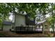 Enjoy outdoor living on the large deck overlooking the private, wooded backyard at 1930 Rocky Mill Ln, Lawrenceville, GA 30044