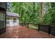 Enjoy the outdoors with a large wooden deck overlooking a private, wooded backyard at 1930 Rocky Mill Ln, Lawrenceville, GA 30044