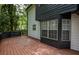 Relax on the spacious back deck with black railings and wooden floors at 1930 Rocky Mill Ln, Lawrenceville, GA 30044