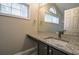 Bathroom featuring a vanity with granite countertops, and a decorative faucet at 1930 Rocky Mill Ln, Lawrenceville, GA 30044