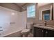 Bright full bath features tub-shower combo, granite vanity, and modern faucet at 1930 Rocky Mill Ln, Lawrenceville, GA 30044