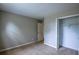 Comfortable bedroom with neutral carpeting, fresh paint and a closet space at 1930 Rocky Mill Ln, Lawrenceville, GA 30044