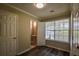 Bedroom with hardwood floors and a view into the en suite bathroom at 1930 Rocky Mill Ln, Lawrenceville, GA 30044