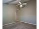 Comfortable bedroom featuring neutral paint, carpet and a ceiling fan at 1930 Rocky Mill Ln, Lawrenceville, GA 30044