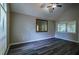 Bedroom features hardwood flooring, vaulted ceiling, and natural light at 1930 Rocky Mill Ln, Lawrenceville, GA 30044