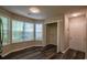 Bright bedroom featuring ample natural light, hardwood floors, and a spacious closet at 1930 Rocky Mill Ln, Lawrenceville, GA 30044