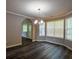 Charming dining room features hardwood floors, modern chandelier, and natural light at 1930 Rocky Mill Ln, Lawrenceville, GA 30044