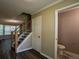 Entryway features updated flooring, staircase, and easy access to a half bathroom at 1930 Rocky Mill Ln, Lawrenceville, GA 30044