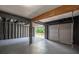 Spacious two-car garage features neutral paint, concrete floor, and a rear exit at 1930 Rocky Mill Ln, Lawrenceville, GA 30044