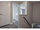 Hallway featuring hardwood floors, staircase, and access to other rooms at 1930 Rocky Mill Ln, Lawrenceville, GA 30044