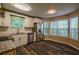 Well-lit kitchen features stainless steel appliances, granite countertops, and dark hardwood floors at 1930 Rocky Mill Ln, Lawrenceville, GA 30044