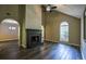 Spacious living room with vaulted ceilings, a black fireplace, and updated flooring at 1930 Rocky Mill Ln, Lawrenceville, GA 30044