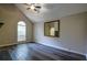 Cozy living room features hardwood flooring, vaulted ceiling, and natural light at 1930 Rocky Mill Ln, Lawrenceville, GA 30044