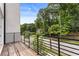 Spacious balcony with wood floors and iron railings, offering an inviting outdoor living space at 2144 Tidwell Ln # 2, Atlanta, GA 30318