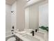 Modern bathroom with a bathtub, matte black fixtures, and a white vanity with countertop at 2144 Tidwell Ln # 2, Atlanta, GA 30318