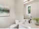 Well-lit half bathroom features a modern vanity, sleek fixtures, and stylish decor at 2144 Tidwell Ln # 2, Atlanta, GA 30318