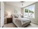Cozy bedroom with a large window, plush bedding, and serene decor for relaxation at 2144 Tidwell Ln # 2, Atlanta, GA 30318