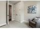 Bedroom with neutral walls and carpet, a cozy armchair, and access to both a closet and ensuite bathroom at 2144 Tidwell Ln # 2, Atlanta, GA 30318