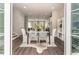 Open-concept dining area with stylish chairs, modern decor, and seamless flow to other living spaces at 2144 Tidwell Ln # 2, Atlanta, GA 30318