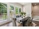 Dining room boasts double glass doors with an outdoor view and staircase access at 2144 Tidwell Ln # 2, Atlanta, GA 30318