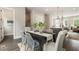 Dining room with seating for six has a modern table setting with a view of the kitchen at 2144 Tidwell Ln # 2, Atlanta, GA 30318