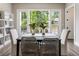 Elegant dining room with large windows offering serene backyard views and sophisticated decor at 2144 Tidwell Ln # 2, Atlanta, GA 30318