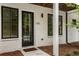 Charming entrance with a black front door, classic windows, and well-maintained landscaping at 2144 Tidwell Ln # 2, Atlanta, GA 30318