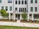 Inviting townhome exterior boasts a welcoming walkway, manicured lawn, and modern design at 2144 Tidwell Ln # 2, Atlanta, GA 30318