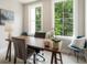 Bright home office with large windows, a modern desk, and comfortable seating, perfect for working from home at 2144 Tidwell Ln # 2, Atlanta, GA 30318