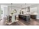 Open kitchen and dining area with quartz countertops, stainless steel appliances, and stylish pendant lighting at 2144 Tidwell Ln # 2, Atlanta, GA 30318
