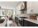 Modern kitchen has stainless steel appliances, white countertops and backsplash with eat in space at 2144 Tidwell Ln # 2, Atlanta, GA 30318