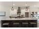 Kitchen island with barstool seating and modern fixtures overlooks the dining area at 2144 Tidwell Ln # 2, Atlanta, GA 30318